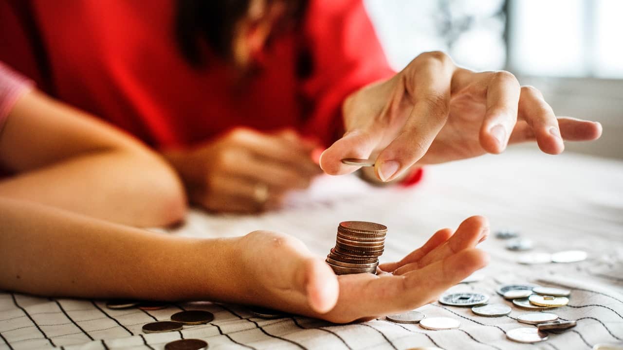 coins on hands